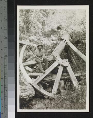 Man and waterwheel