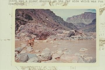 Bill and Buzz Belknap working over the boulders to get to the bedrock at Bedrock Rapid. There was a clear channel on the far side which was run in the Sportyaks